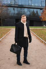 Confident businessman on cityscape in daylight