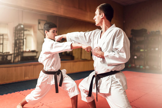 Martial arts masters, self-defence practice in gym