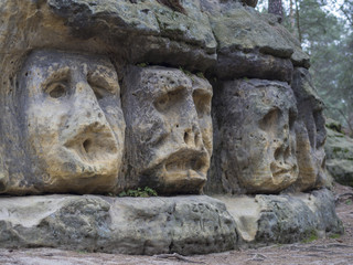 Fototapeta na wymiar big head sculpted in 1846 by Vaclav Levy to the sand stone rock in Zelizy, czech republic