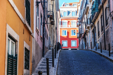 Fototapeta na wymiar Lisbon, the capital of Portugal, narrow street in the historic old town center, image with retro toning