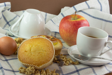 Brioches egg apple and coffee for the breakfast
