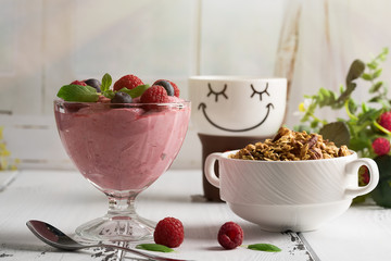 Healthy breakfast: Curd souffl? with fresh blueberry, raspberries, granola and tea