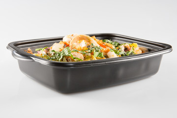 takeaway food in black microwavable containers