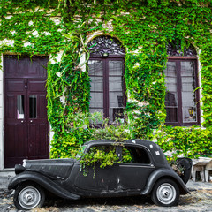 Old car parked in historic quarter in Colonia del Sacramento, Uruguay. Colonia del Sacramento is...