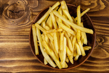 French fries on wooden table