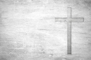 Naklejka premium White old christian religion symbol cross shape as sign of belief on a grungy wood textured with copy space.