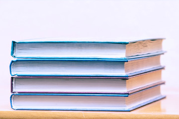 Pile of books on a light background