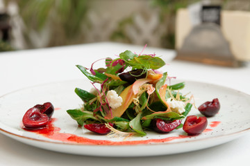 Light salad with berry dressing