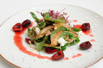 Light salad with berry dressing