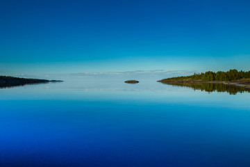 Calm on the water. Water walks in Finland. Frostbite islands in the water. Finland in the summer.
