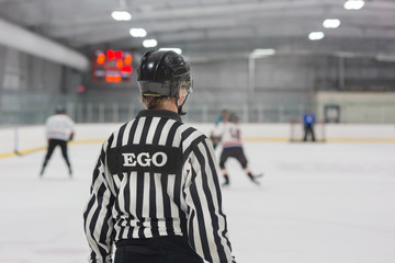 Hockey referee with a humorous name plate