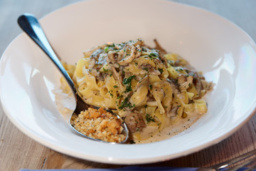 Pasta with cream, mushrooms and fried bread crumbs