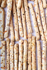 Breadstick background with red pepper and cheese