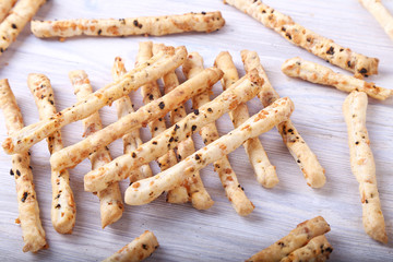 Breadsticks on wooden background