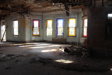 Fototapeta na wymiar Stained glass windows in abandoned building 