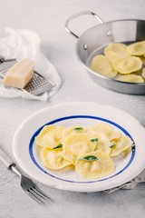 ravioli pasta with parmesan cheese and sage