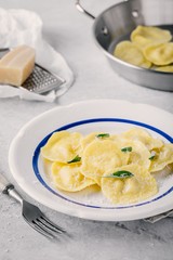 ravioli pasta with parmesan cheese and sage