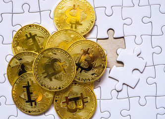 Group a Gold bitcoin on jigsaw background. with business concept