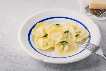 ravioli pasta with parmesan cheese and sage