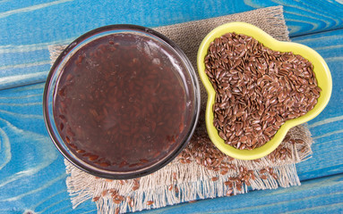 Raw and boiled linseed, organic food for healthy eating.