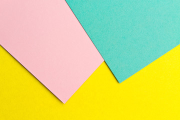 Pink yellow and turquoise paper texture background Color. Trending colors, geometric background of the paper. Colorful soft paper background.Pastel color.
