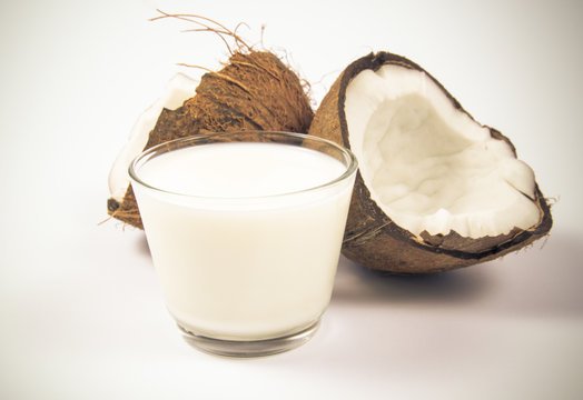 Coconut with coconut milk isolated on white background.
