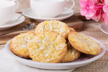 Pile of lemon crackle cookies on a plate