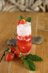 Strawberry cocktail on wooden table