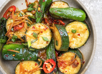 Traditional Korean banchan with kimchi and vegetable as top view on a plate