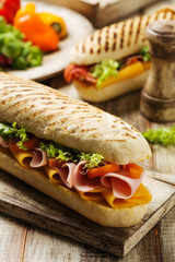 Traditional Italian sandwich with ham and cheese served warm. © gkrphoto