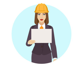 Businesswoman in construction helmet  holding a paper