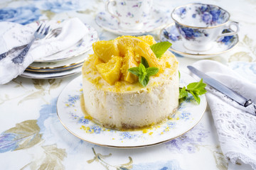 Traditional lemon cheesecake as top view on a plate