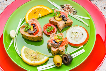 Cold appetizer. Tuna medallions with selection of fruits and vegetables
