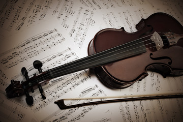 Fototapeta premium Violin and bow with music sheet notes