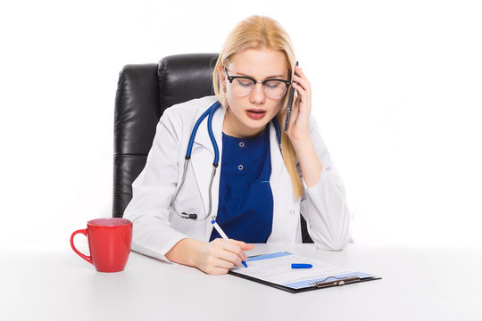 Female Doctor In White Coat With Telephone