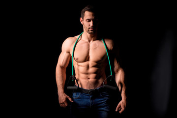 Fototapeta na wymiar Fitness concept. Muscular and sexy torso of young man having perfect abs, bicep and chest. Male hunk with athletic body.