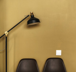stylish black lamp against the mustard wall background