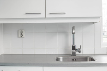 Modern empty new kitchen sink with silver tap