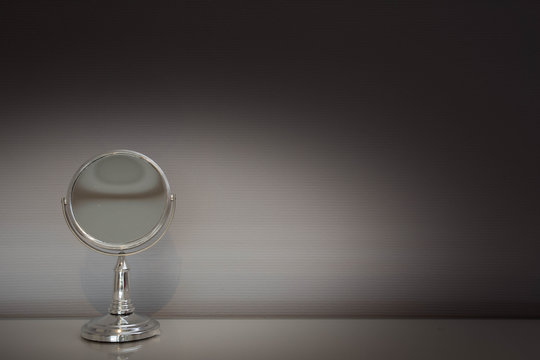 Modern silver mirror vintage design with dark background