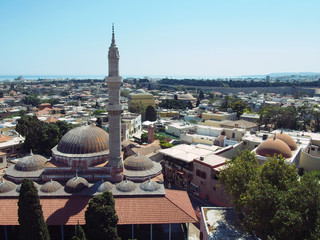 Naklejka premium panoramic view of rhodes town showing the mosque and city center with medieval walls and sea on the horizon