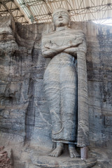 Standing Buddha statue at Gal Vihara rock temple in the ancient city Polonnaruwa, Sri Lanka