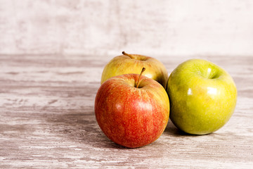 Fresh apples on wooden table