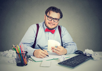 Content chunky man at workplace