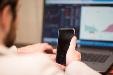 Businessman checking his stocks