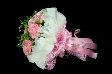 Bouquet of Pink Carnation flowers isolated on black background. Bridal bouquet