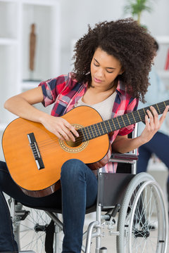 disabled girl playing guitar