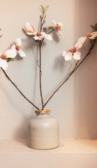 Orchid flowers in ceramic vase 