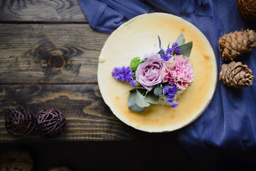Flower cheesecake on a wooden table