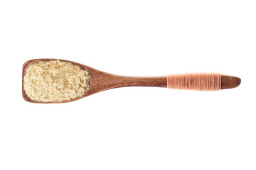 spice cardamom powder in  wooden spoon isolated on a white background, top view