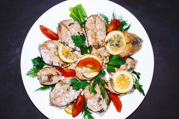 Baked salmon fish fillet with tomatoes,spices., lemon. Diet menu.